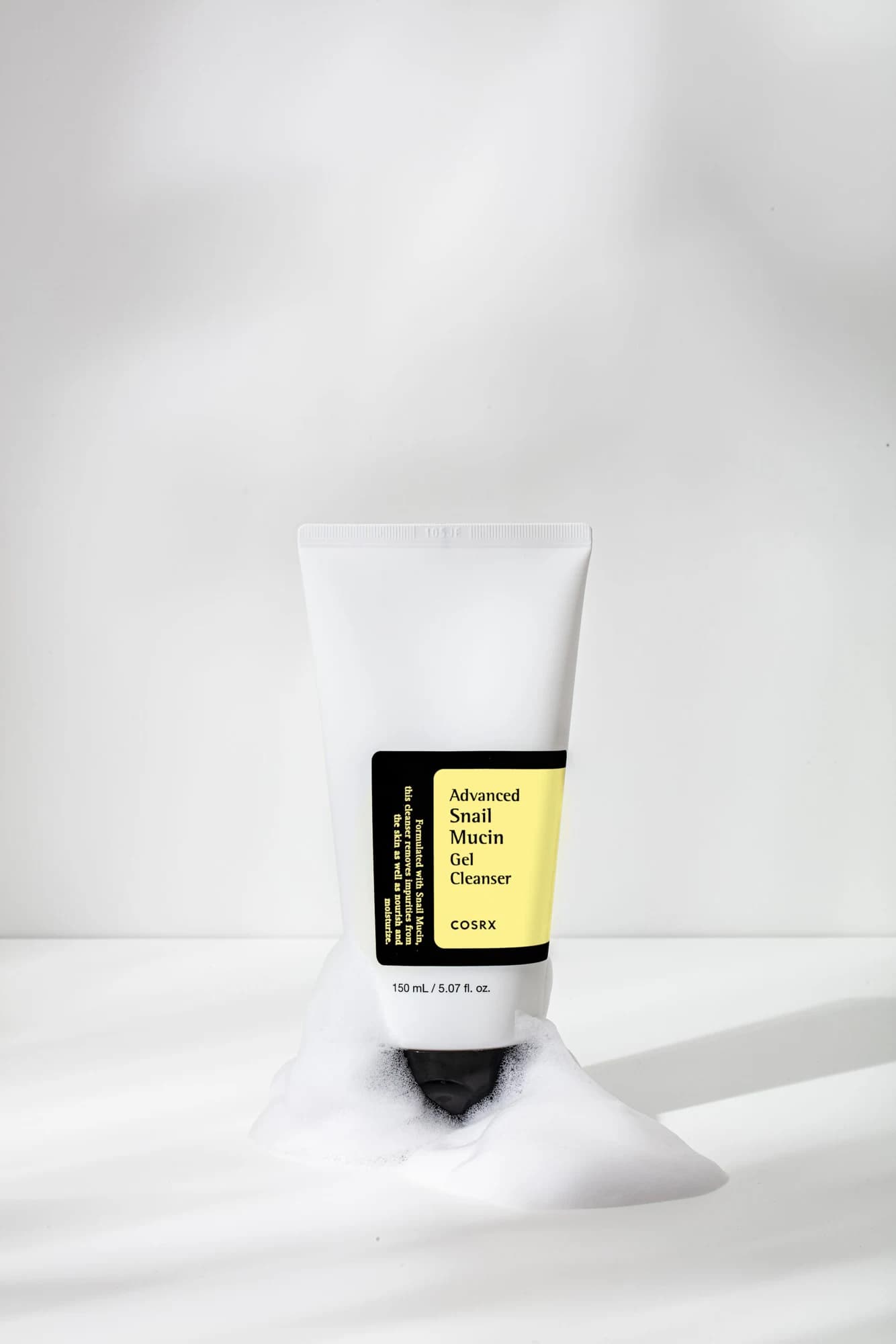 COSRX Snail Mucin Gel Cleanser among soft bubbles